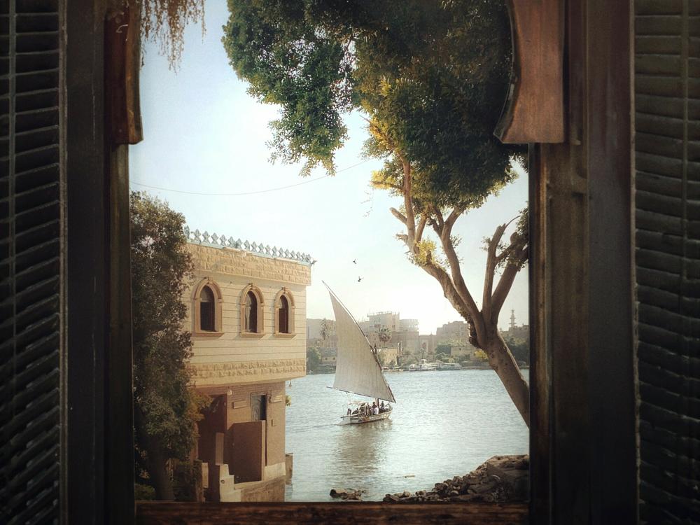 El Massry took this photo of a felucca sailing down the Nile in the south of Cairo on a morning in 2022. He digitally framed the image with a photo of a window in an old antique shop, and in his signature style, added a bird or two.