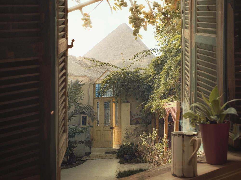 A view of the Great Pyramids of Giza taken from a hotel on a warm morning in 2022. El Massry says he digitally added birds to 