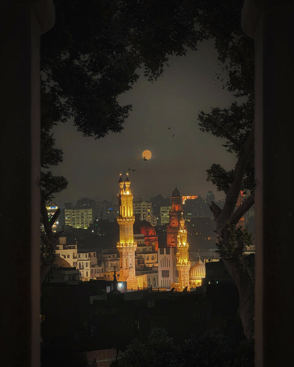 A view of Cairo's ancient Al-Azhar Mosque, established in the year 972 during the Fatimid Caliphate, and the Qalawun complex, built in 1285, on a November night in 2023. El Massry wanted the photo to feel 