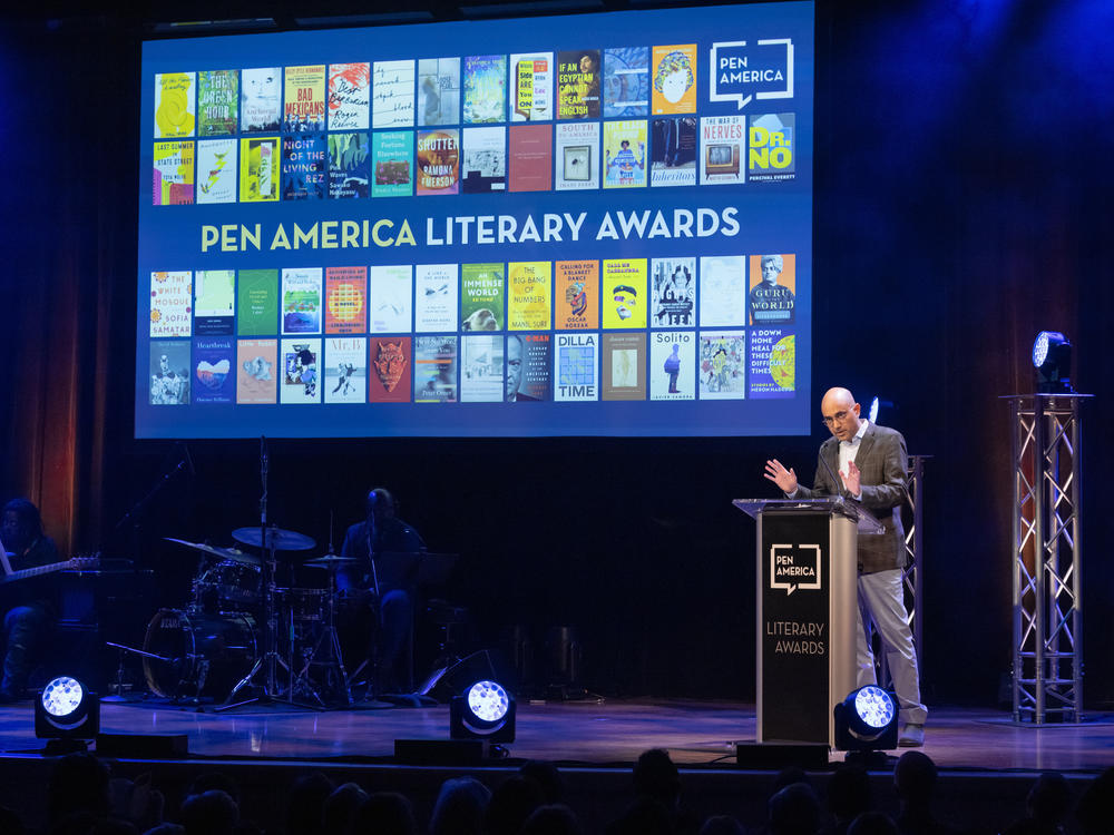 Playwright Ayad Akhtar on stage at the 2023 PEN America Literary Awards in his role as then-president of the organization.