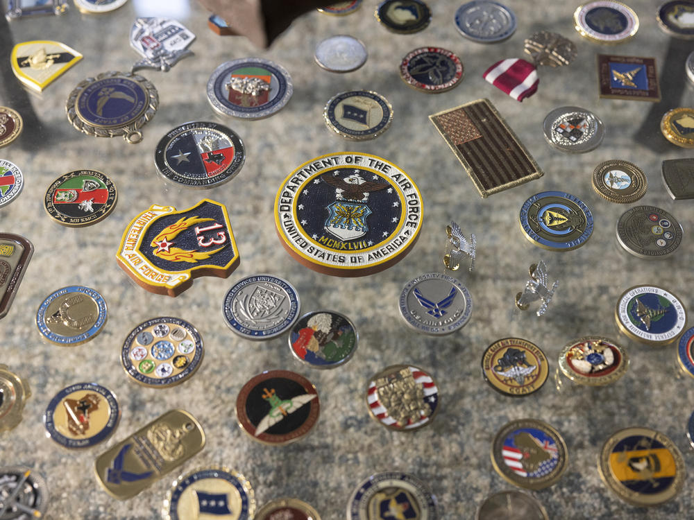 Rasmussen's challenge coin collection from his military service is on display at his home office.