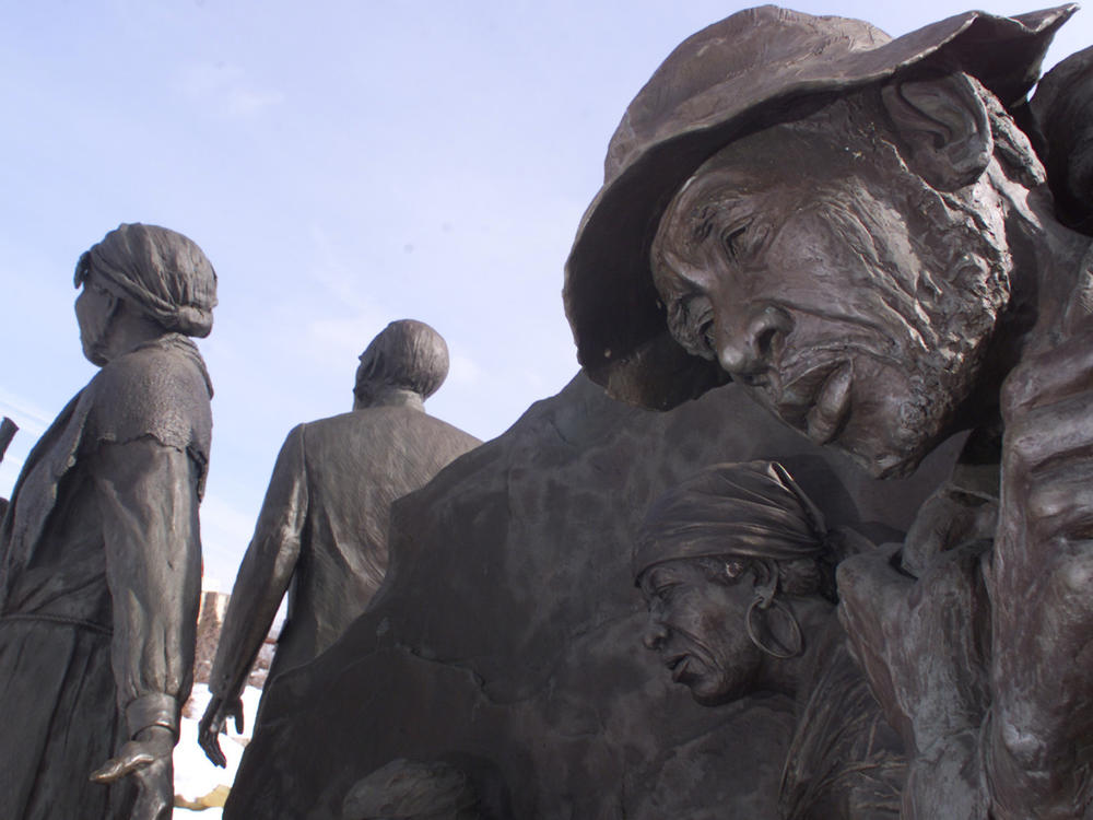 One of Ed Dwight's sculptures in Battle Creek, Mich., depicts escaped slaves along the Underground Railroad being led to freedom by Harriet Tubman and local abolitionist Erastus Hussey.