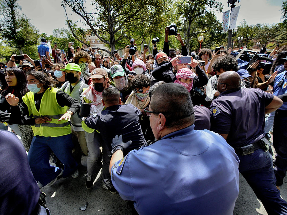 Protesters at the University of Southern California push and shove university police officers as tempers get heated during a pro-Palestinian occupation on the campus on Wednesday in Los Angeles.
