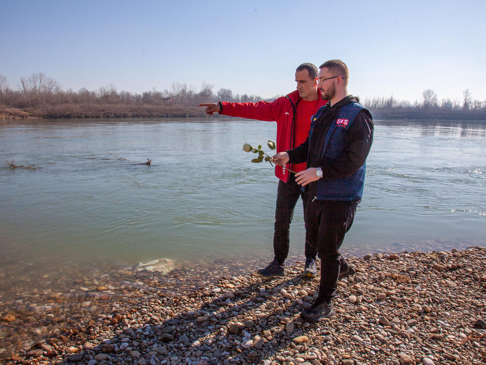 Nihad Suljić of Tuzla helps families of lost migrants; Nenad Jovanović is part of the Bosnian Mountain Search and Rescue operations, which recovers the bodies of those who drown in the Drina River. They're dropping four white roses in memory of those who perished. 