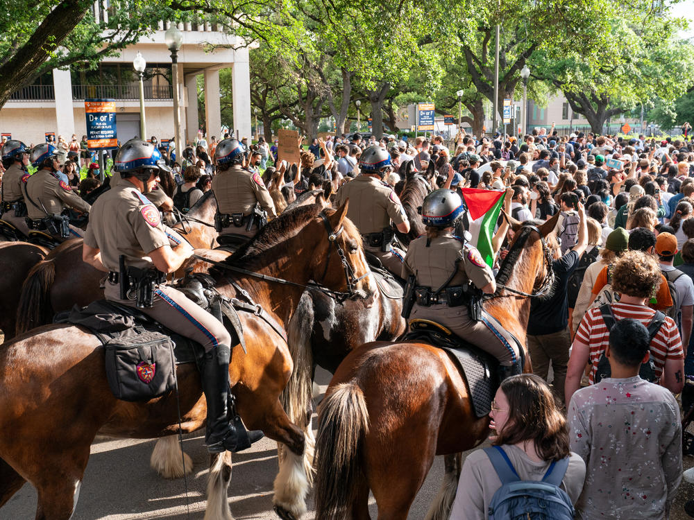 Texas State Troopers on horseback work to disperse pro-Palestinian students protesting the Israel-Hamas war on the campus of the University of Texas at Austin on Wednesday.
