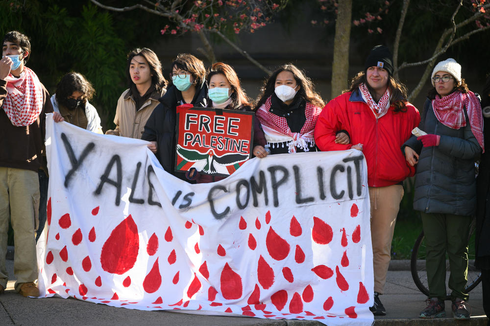 Yale students stage a protest in an intersection in downtown New Haven on April 22, 2024 after police cleared an encampment outside the Beinecke library, where Pro-Palestinian demonstrators had staged tents for three nights calling for the school to divest its endowment from weapon manufacturers they say play a role in Israel's war in Gaza.