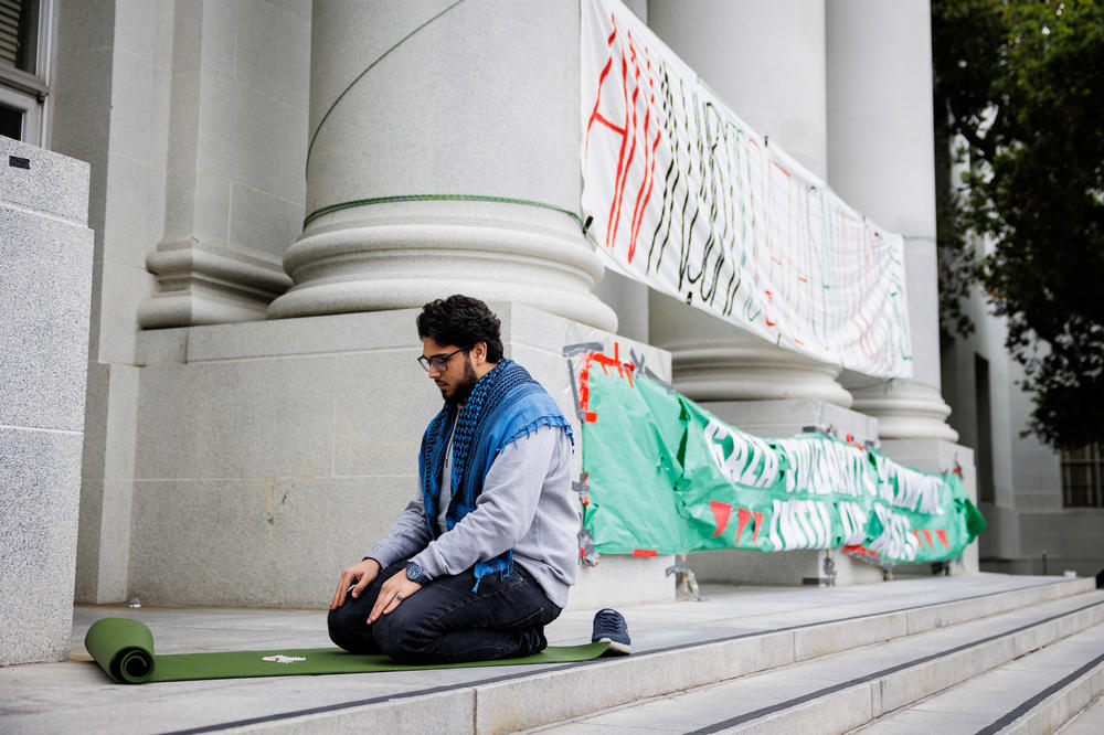 UC Berkeley Student Yahya Ahmed prays at the UC Berkeley Gaza Solidarity Encampment in front of Sproul Hall on Apr. 23, 2024.