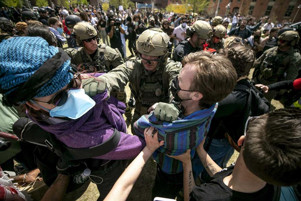 Officers surrounded the camp on the Tivoli Quad and began attempting to remove the two dozen or so people who refused to clear out at the Auraria Campus.