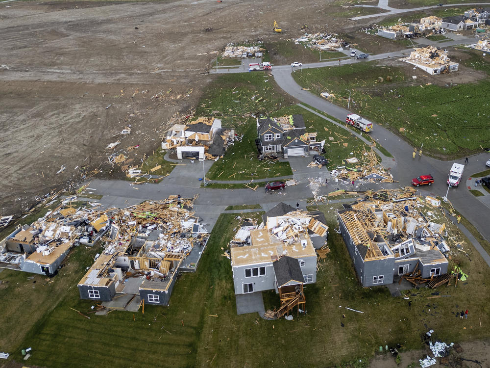 Damaged houses are seen after a tornado passed through the area near Omaha, Neb., on Friday.