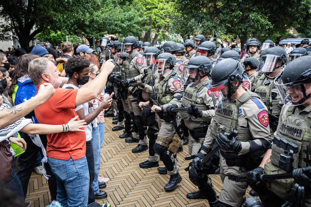 Law enforcement form a barrier while arresting students taking part in a pro-Palestinian walkout and protest on April 24, 2024, at the University of Texas at Austin.