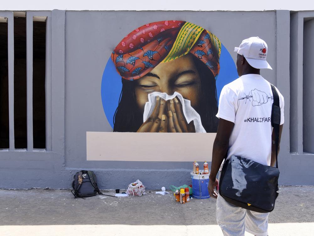 Don't just sneeze without a tissue! That's the message of this early pandemic era graffiti in Dakar, Senegal. The World Health Organization has just issued an updated report on the way SARS-CoV-2 spreads. Take our quiz to see if you're up on your COVID terminology.