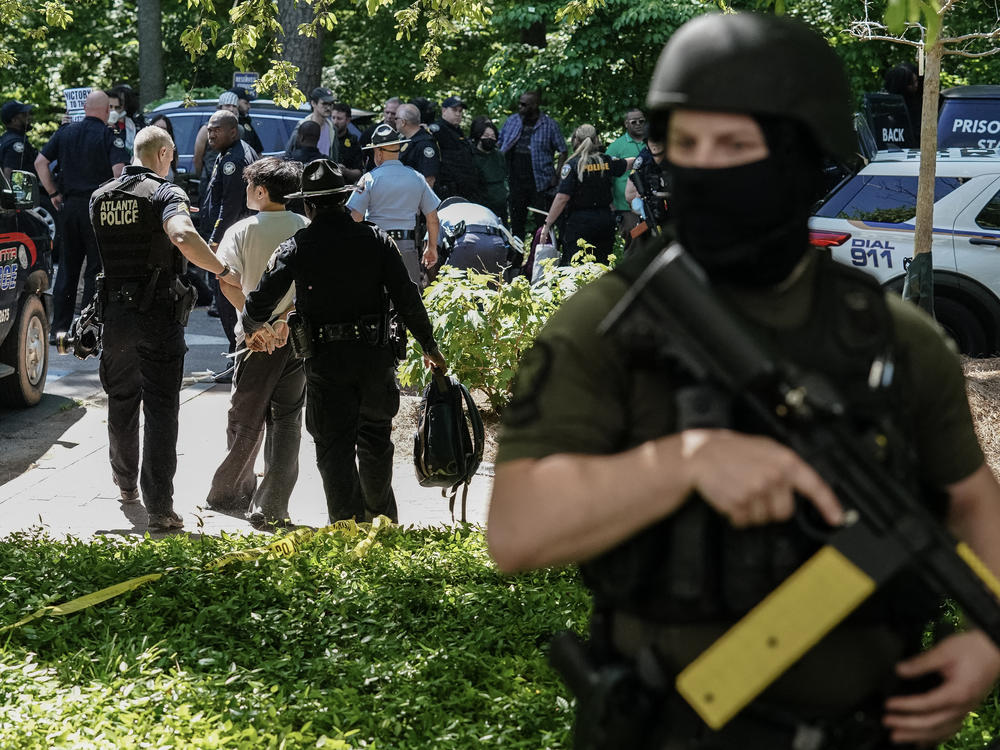 Police officers arrest a protester as pro-Palestinian students demonstrate at Emory University on Thursday.