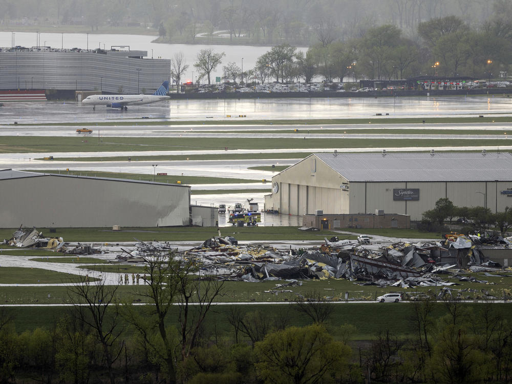 Severe weather damage to Eppley Airfield in Omaha can be seen from the Lewis and Clark Monument in Council Bluffs, Iowa, on Friday.