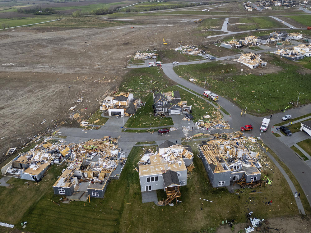 Damaged houses are seen after a tornado passed through the area near Omaha on Friday.