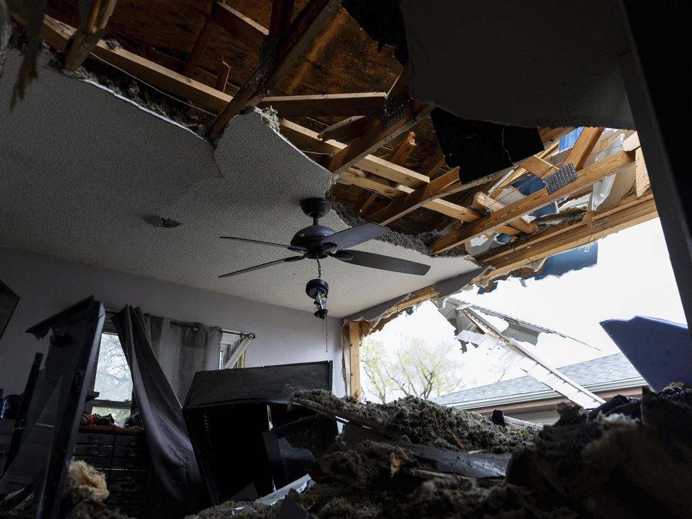 Damage is seen to Justin and Amanda Putnam's bedroom after a severe storm damaged their neighborhood in Council Bluffs, Iowa, on Friday.