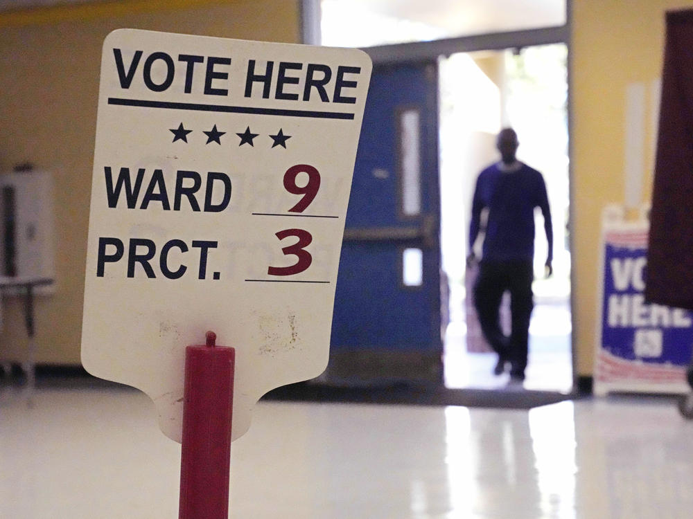 A voter enters the Dr. Martin Luther King Jr. Charter Elementary School in New Orleans to cast a ballot in the 2022 elections.