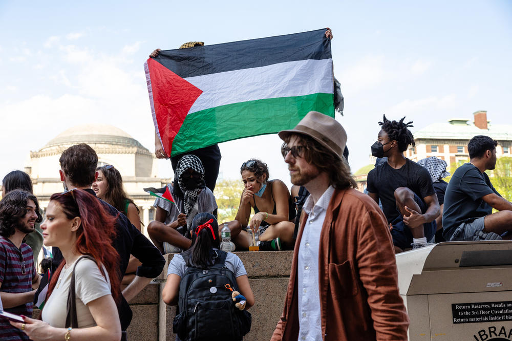 Pro-Palestinian demonstrators march around the 