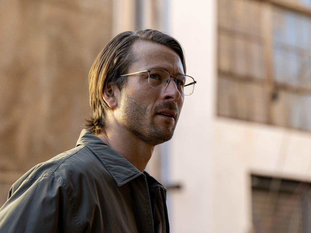 Glen Powell stars in the new movie <em>Hit Man</em>.