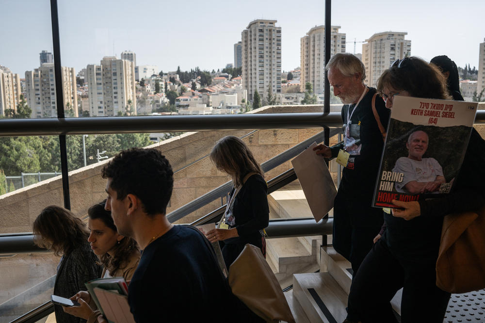 Lee Siegel, relatives and friends make their way through the Knesset in Jerusalem to speak before committee meetings on March 26. 