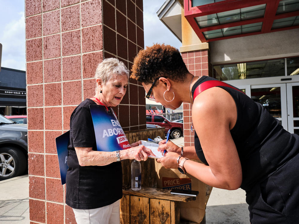 Alice Kitchen, 81, canvasses for signatures at a Costco parking lot in Kansas City, Mo. She and other abortion rights advocates are trying to collect 172,000 valid signatures by May 5 to ensure a statewide ballot measure in November on whether to enshrine abortion rights in Missouri's constitution.