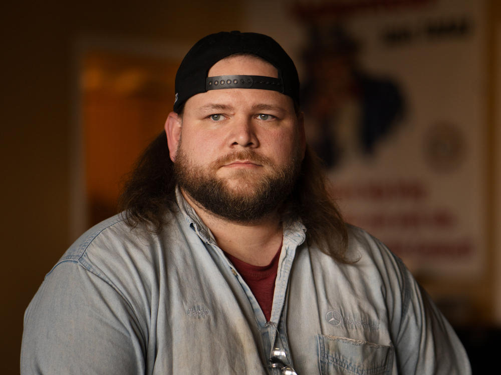 As a new, temporary employee 10 years ago, Jacob Ryan was afraid to be seen holding a pro-union flier. Nowadays, he's the guy handing out fliers, always wearing his union hat.