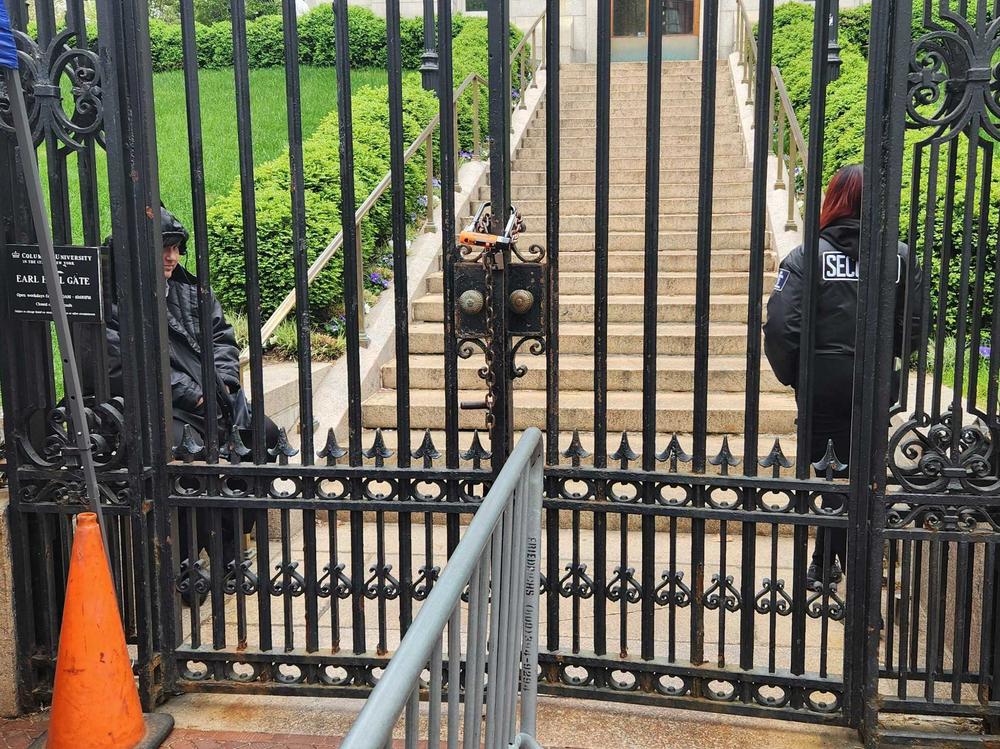 A gate that has been a main access point into Columbia University's Morningside campus was locked Tuesday morning, as the school restricted access to only those students who live on the campus, and essential workers.
