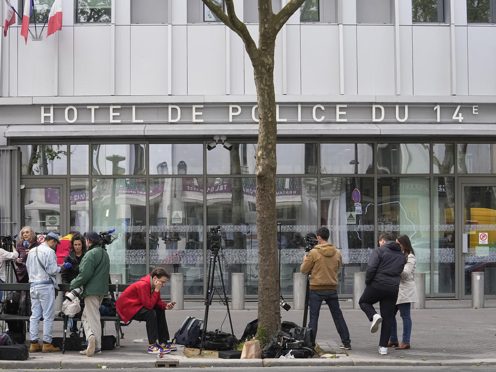 Reporters wait outside the police station where French actor Gerard Depardieu is being questioned, Monday, April 29, 2024 in Paris.