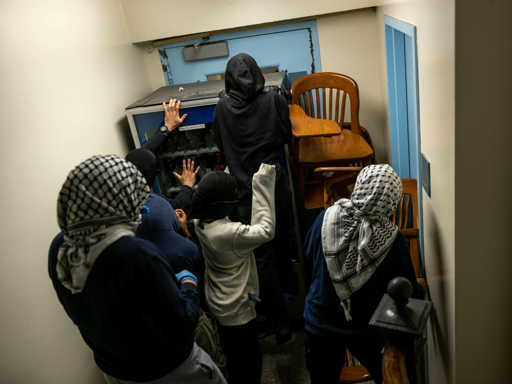 Demonstrators supporting Palestinians in Gaza barricade themselves inside Hamilton Hall, where the office of the dean is located, on April 30 in New York City.