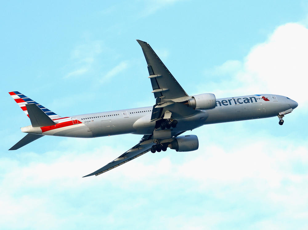 An American Airlines jet flies over Nickerson Beach Park on Sept. 4, 2023, in Lido Beach, N.Y. Passengers should pay attention when the captain warns about turbulence.