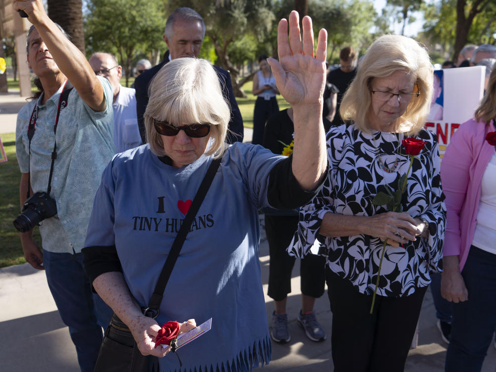 Anti-abortion rights advocates demonstrate prior to an Arizona House of Representatives session at the Arizona state Capitol on April 17 in Phoenix.