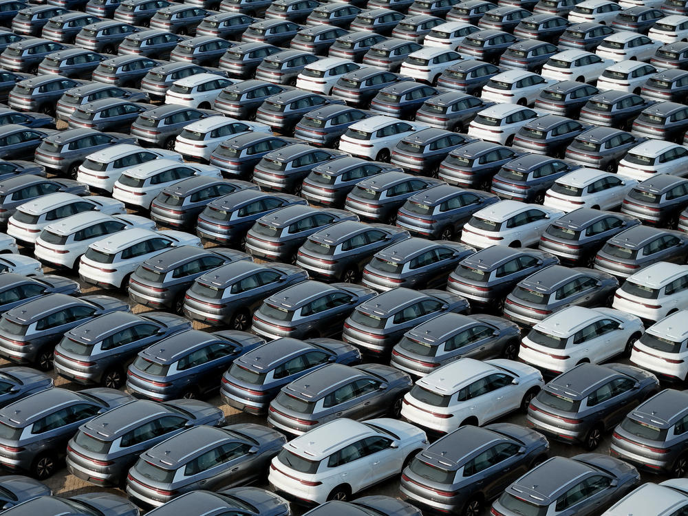 BYD electric cars wait to be loaded onto a ship at a port in Yantai, China, on April 18. China has rapidly become a major auto exporter, but tariffs have kept cheap Chinese EVs out of the U.S. market — so far.