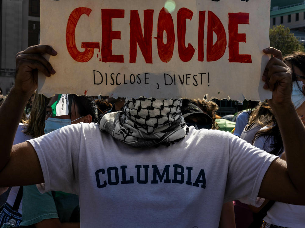 A demonstrator protests outside the encampment established in support of Palestinians in Gaza at Columbia University on April 29, 2024. Columbia protesters are demanding their university sell off investments in a number of companies with business ties to Israel.