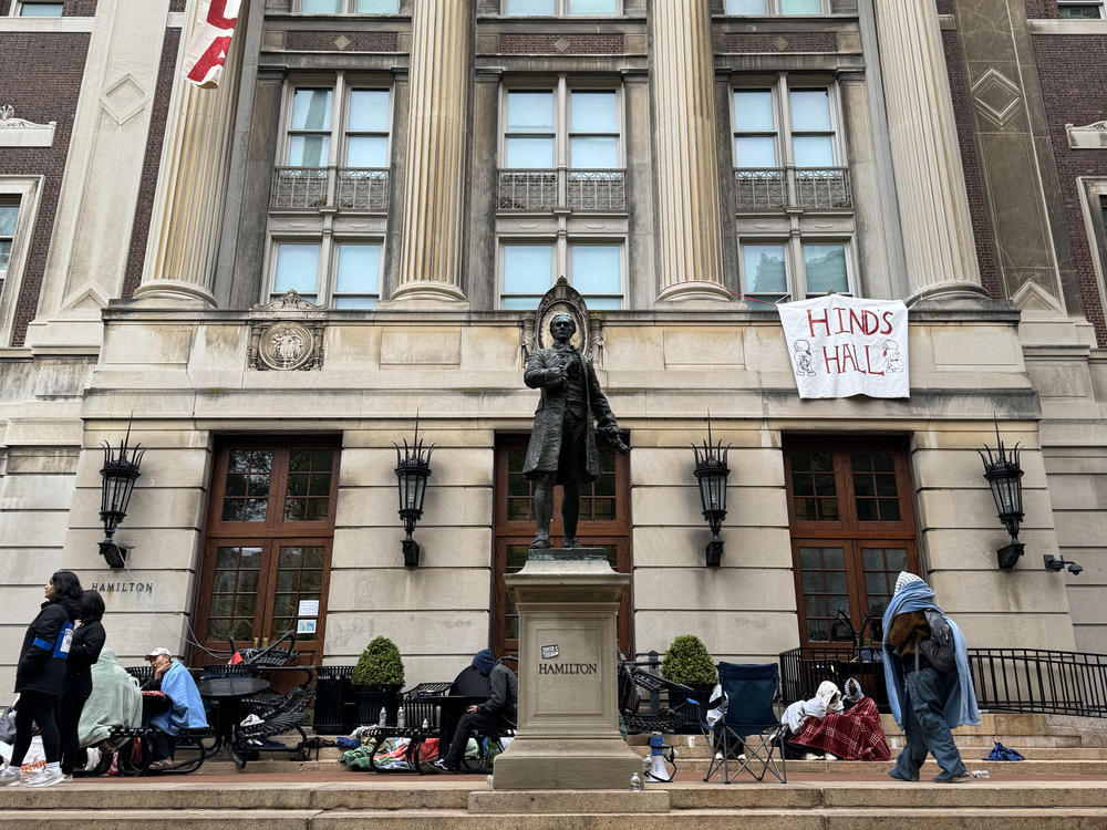 Pro-Palestinian student protesters sit on the front steps of Hamilton Hall at Columbia University in New York City on April 30, the morning after protesters took over the college building.