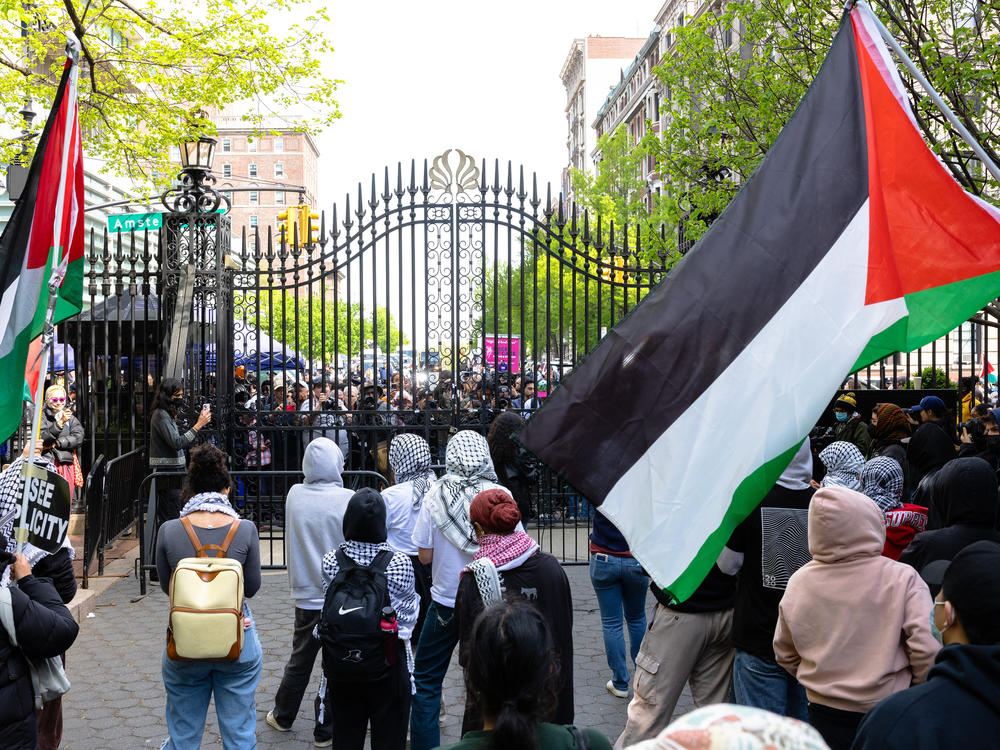 Student protestors chant near an entrance to Columbia University on April 30. Columbia University has restricted access to the school's campus to students residing in residential buildings on campus and employees who provide essential services to campus buildings after protestors took over Hamilton Hall overnight.
