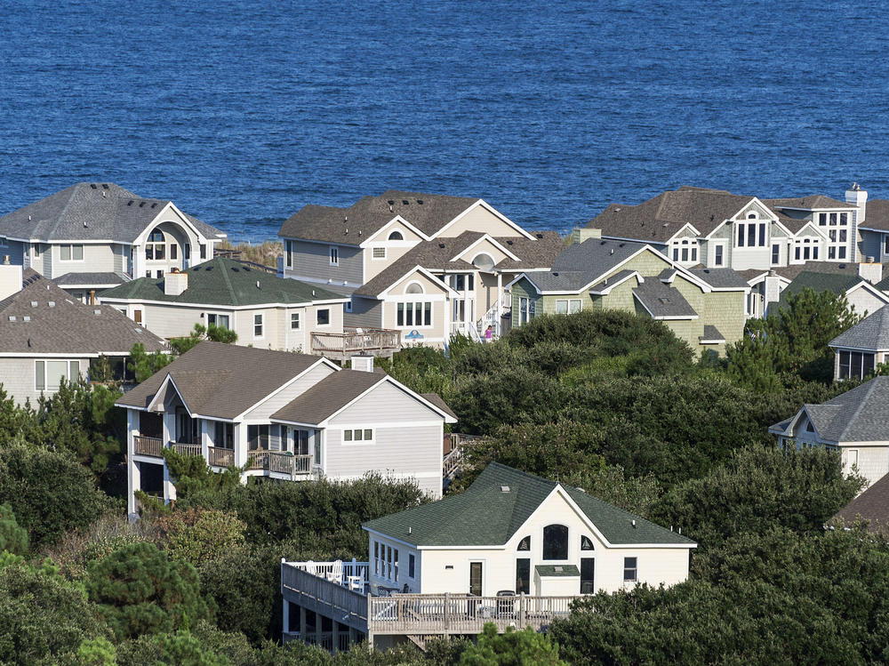 A cabinet maker in North Carolina is seeing interest rates slow down home development. His clients in the Outer Banks though, pictured here, are moving ahead as normal.