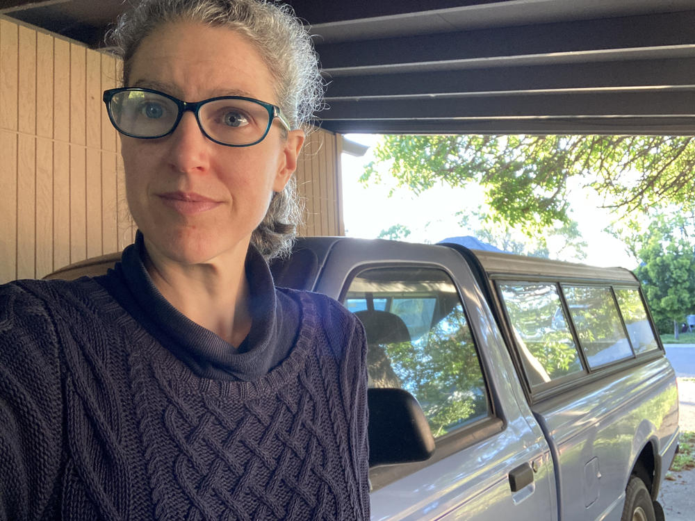 Bonnie Dixon, pictured with her 1997 Ford Ranger, drives only about once a week. When she does, she would prefer to be driving a zero-emission vehicle. But she can't find a new one in her budget.