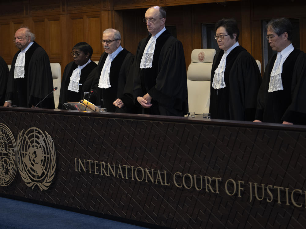 Presiding judge Nawaf Salam (fourth from left) arrives to read a decision at the International Court of Justice in The Hague, Netherlands, Tuesday.