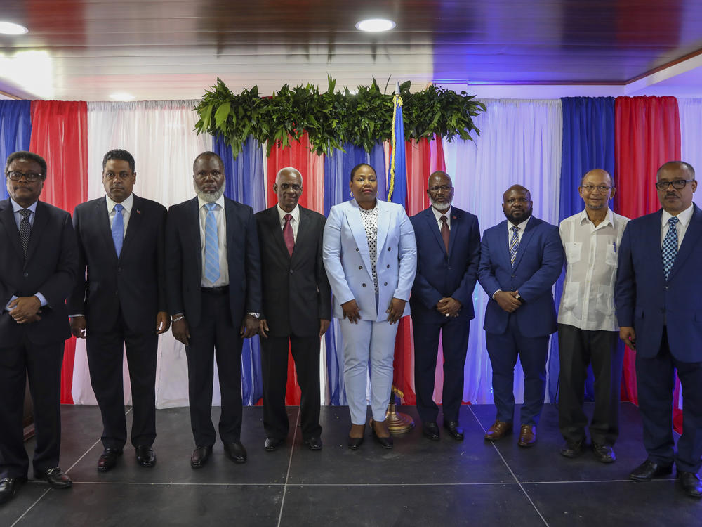 Transitional Council members, from left to right; Fritz Alphonse Jean, Laurent Saint-Cyr, Frinel Joseph, Edgard Leblanc Fils, Regine Abraham, Emmanuel Vertilaire, Smith Augustin, Leslie Voltaire and Louis Gerald Gilles, pose for a group photo after a ceremony to name its president and a prime minister in Port-au-Prince, Haiti, Tuesday, April 30, 2024.