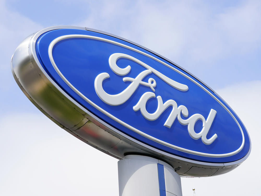A Ford sign is shown at a dealership in Springfield, Pa., in 2022. Ford is recalling nearly 243,000 Maverick small pickup trucks in the U.S. because the tail lights may not illuminate.