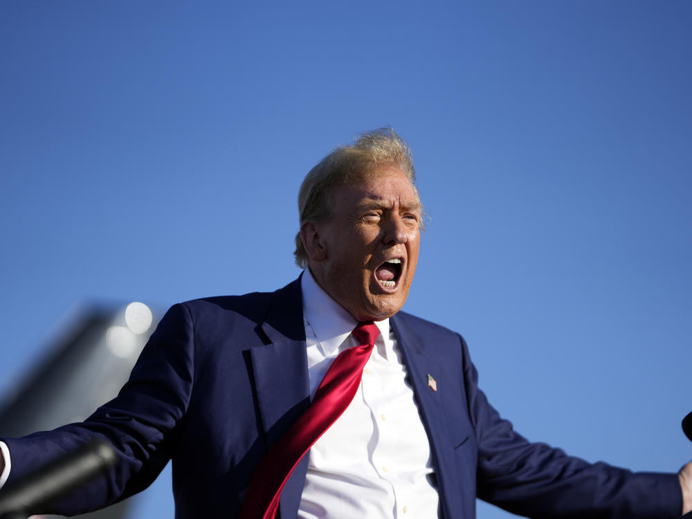 Republican presidential candidate and former President Donald Trump speaks at a campaign rally in Freeland, Mich., on Wednesday. A pair of rallies in the pivotal states of Wisconsin and Michigan are his first campaign trail appearances since his trial in New York over alleged campaign finance violations started.