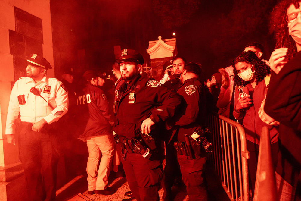 Pro-Palestinian supporters confront police during demonstrations at The City College Of New York as the NYPD cracks down on protest camps at both Columbia University and CCNY on Tuesday in New York City.