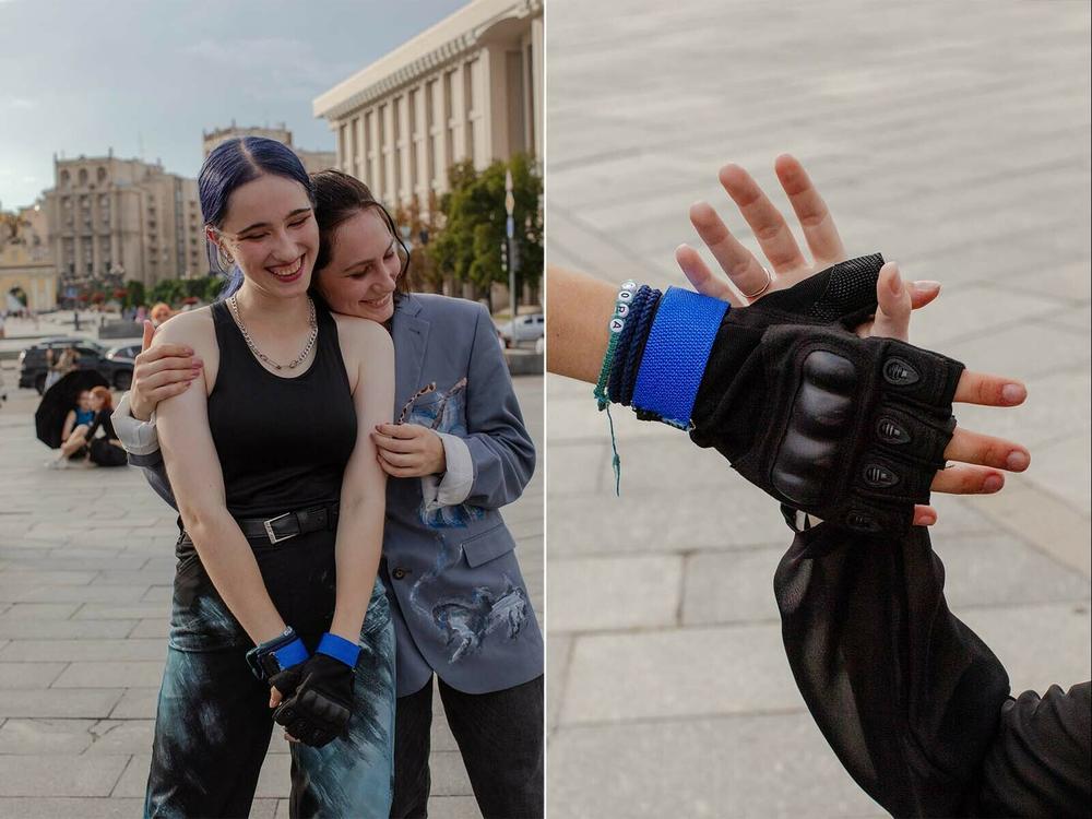 Left: Phantom Blue dancers hug and laugh after they finish a recording take. Right: Phantom Blue dancers clap their hands together during recording.
