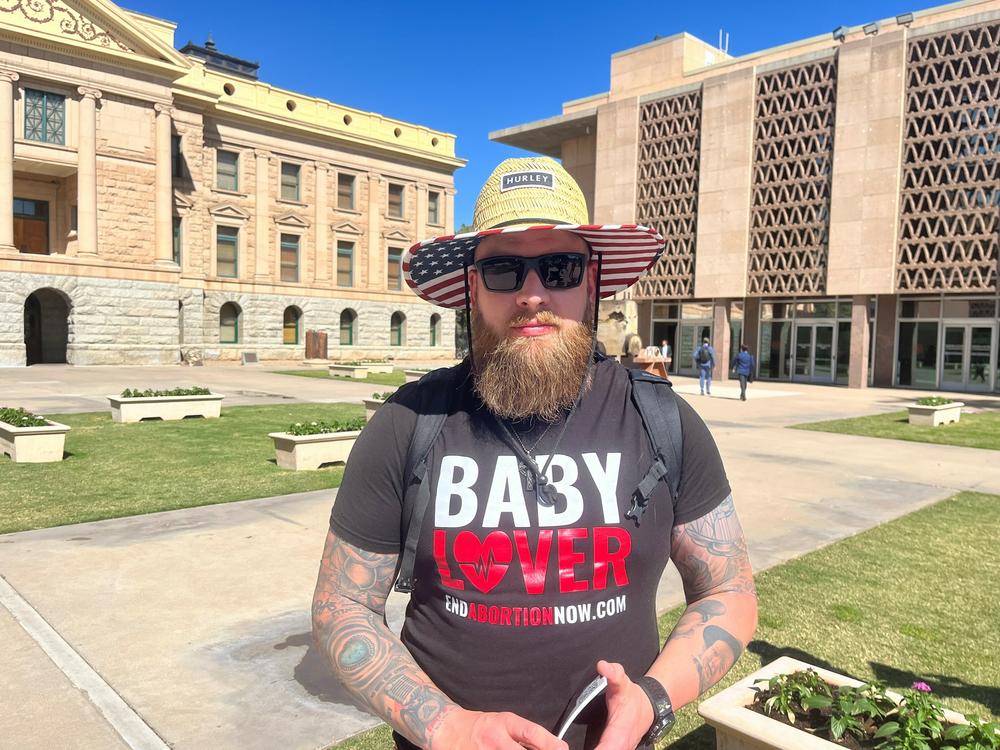 Luke Pierson, co-founder of End Abortion Now, which describes itself as a movement to end access to abortions, demonstrated outside of Arizona's statehouse on April 17 in Phoenix.