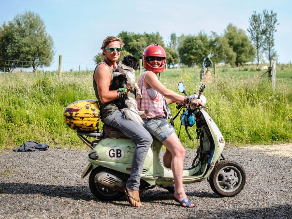 Tommy and Emma Trenchard are siblings who share an unusual ability to pick up all kinds of objects with their toes. Joining them in the photo, taken in England where they grew up, is Emma's dog.
