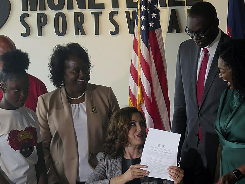A number of Democratic lawmakers have reintroduced the CROWN Act, legislation that would ban discrimination based on one's hairstyle or hair texture. Here, Michigan Gov. Gretchen Whitmer signs Crown Act legislation on June 15, 2023 in Lansing, Mich. that will outlaw race-based hairstyle discrimination in workplaces and schools.