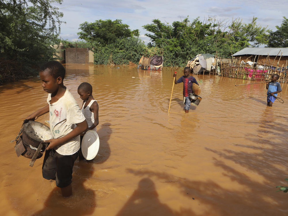 Children fleeing floodwaters that wreaked havoc at Mororo, border of Tana River and Garissa counties, northeastern Kenya, April 28.