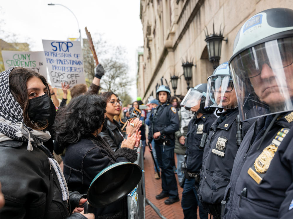 Students and pro-Palestinian activists face police as they gather outside of Columbia University to protest the university's stance on Israel's war in Gaza.