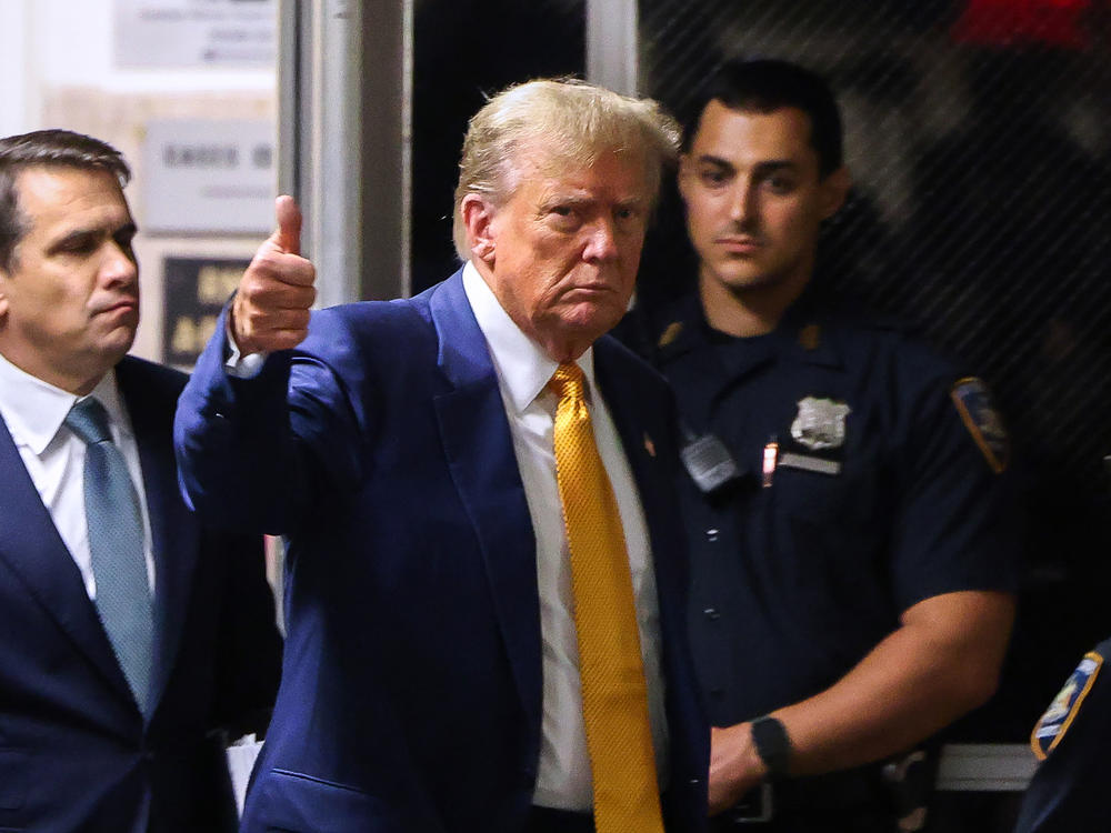 Former U.S. President Donald Trump gives a thumbs up as he returns to the courtroom after a break in his trial for allegedly covering up hush money payments at Manhattan Criminal Court on May 2, 2024 in New York City.