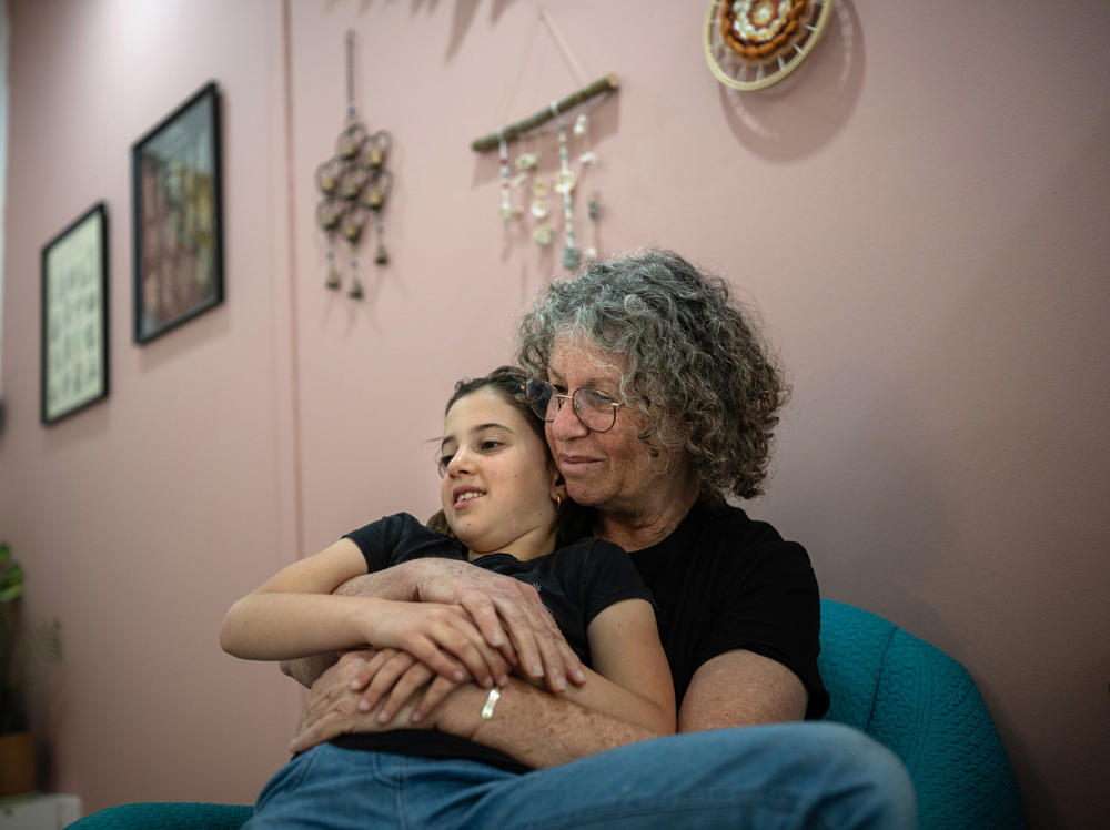 Aviva Siegel, who was held hostage in Gaza for 51 days, and whose husband Keith remains in Hamas captivity, spends time with her eight-year-old granddaughter Yali Tiv at her daughter's home on Kibbutz Gazit on March 26. Aviva has been staying with her daughter in northern Israel since being released in November.