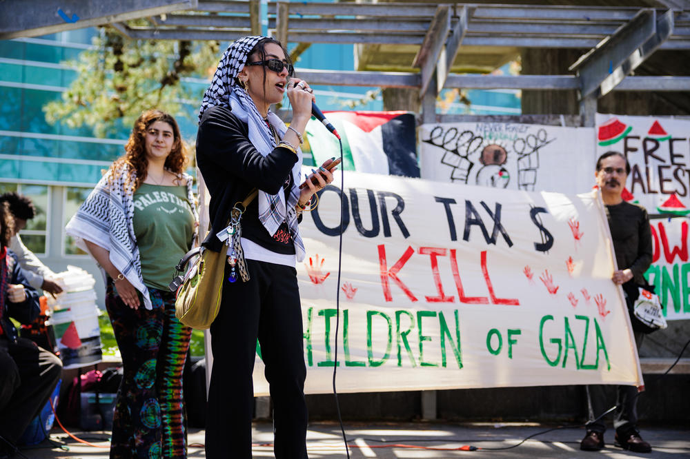 San Francisco State University student Zinaib I. speaks at a rally outside the Cesar Chavez Student Center at SFSU on April 30.